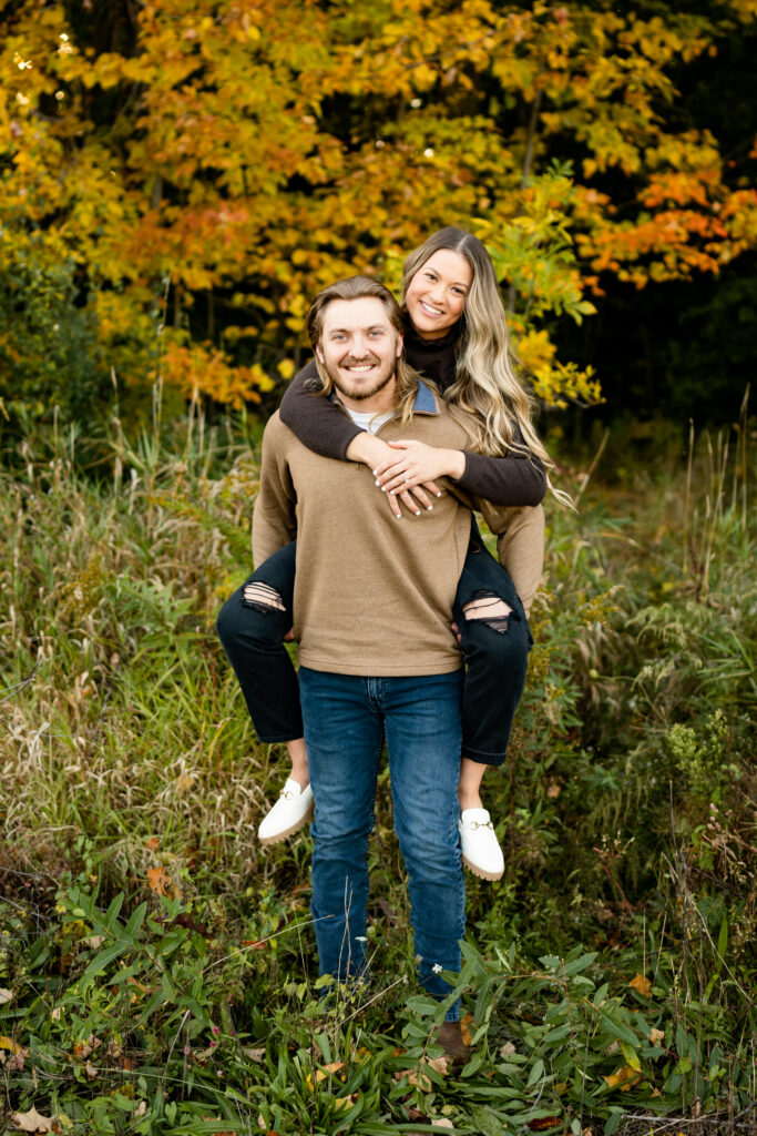 Kristen and Levi's fall engagement session in an apple orchard. The couple wore the perfect neutral outfits that complemented each other perfectly. 