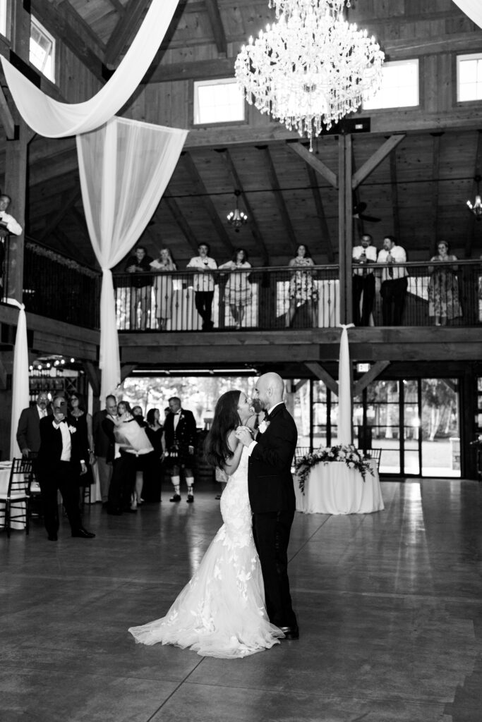 Timeless wedding photos taken at Colloca Winery and Estate. The couple is enjoying their wedding reception with their family and friends.