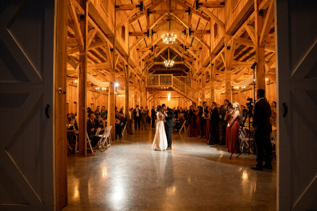 The happy couple share a romantic moment on the dance floor, captured by their wedding photographer. Learn the essential questions to ask during your photographer consultation call.