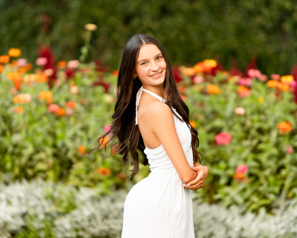This photo is from Hannah's senior session. It is meant to display how senior picture poses can make or break your session. Her session took place in a beautiful garden surrounded in flowers.
