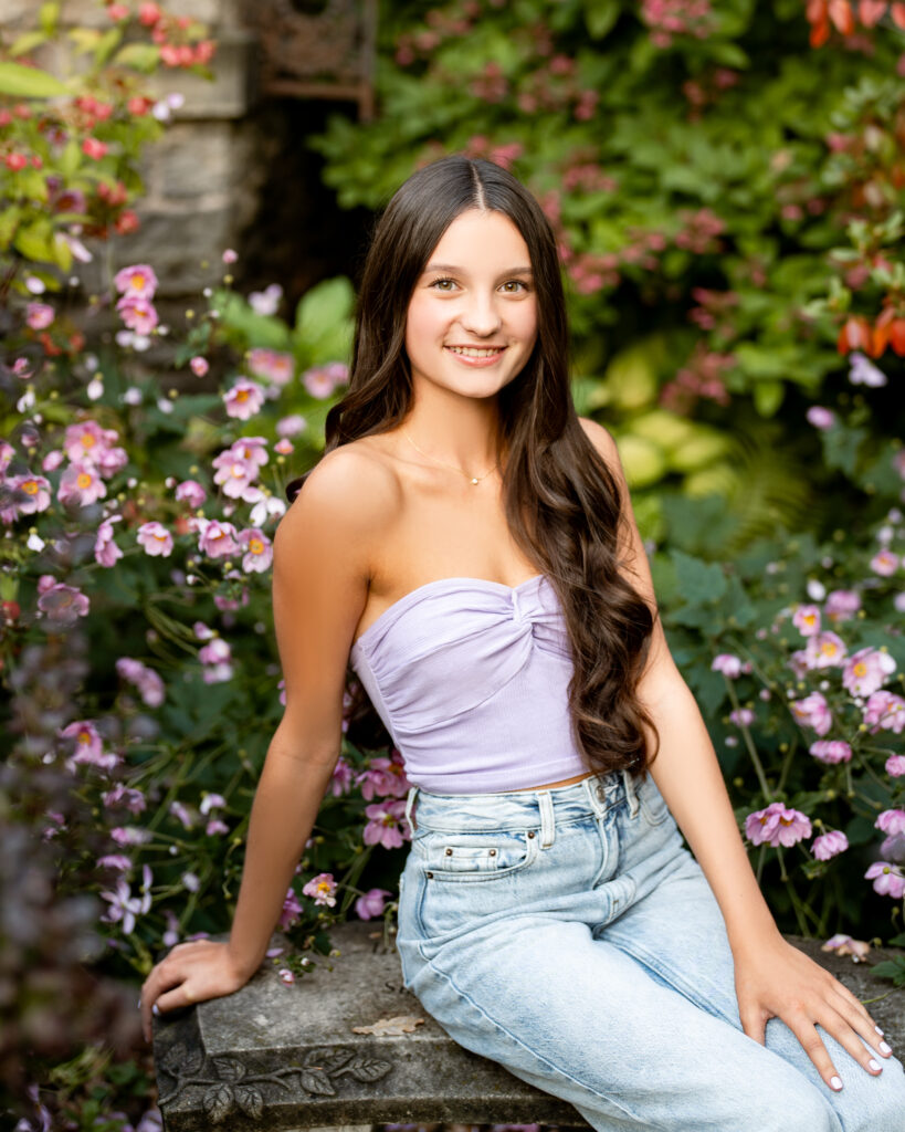 This photo is from Hannah's senior session. It is meant to display how senior picture poses can make or break your session. Her session took place in a beautiful garden surrounded in flowers.